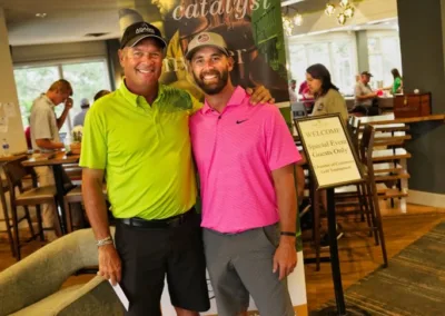 two people smiling in clubhouse at golf course