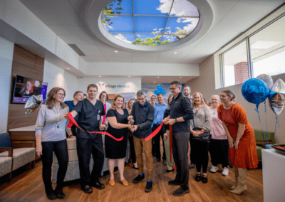 group of people doing a ribbon cutting in a business