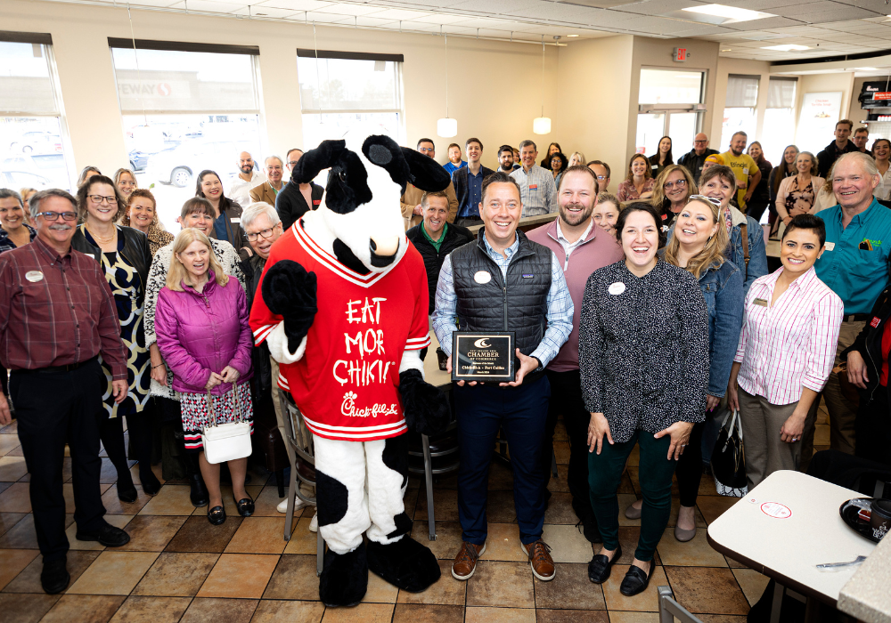 Large group photo inside a Chick-fil-A restaurant