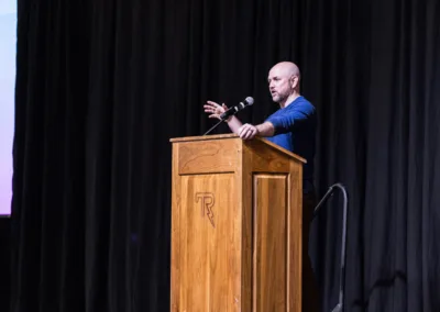 Man speaking at a podium