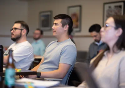 man sitting in a classroom with others