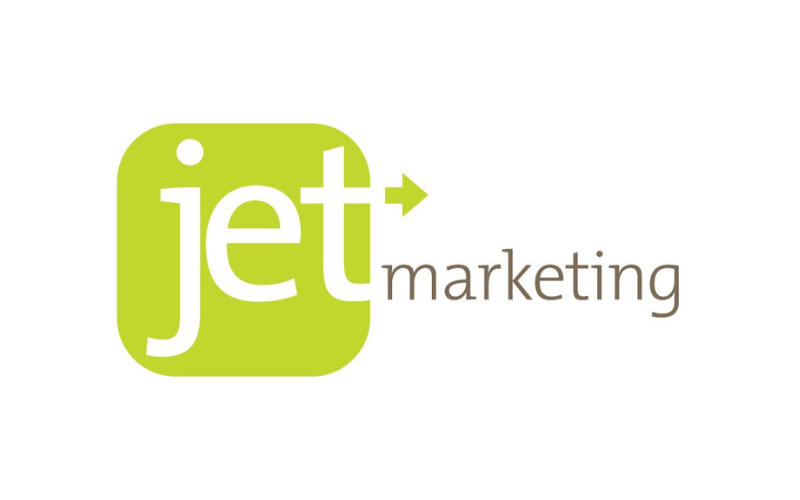 A logo featuring a green rounded square with the word "jet" in white lowercase letters. An arrow forms the right side of the "t". The word "marketing" is written in brown lowercase letters to the right of the green square.