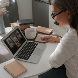 Woman sitting at a desk working on her laptop