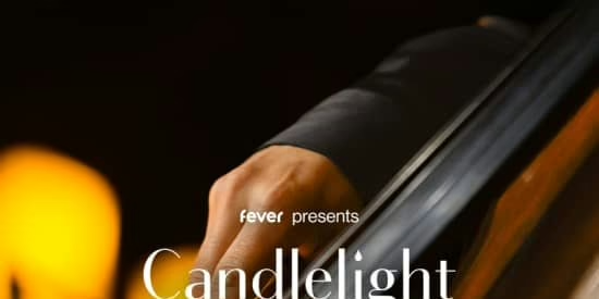 Close-up of a person playing a string instrument under warm candlelight. The text "fever presents Candlelight" is partially visible, suggesting a musical event or concert ambiance.