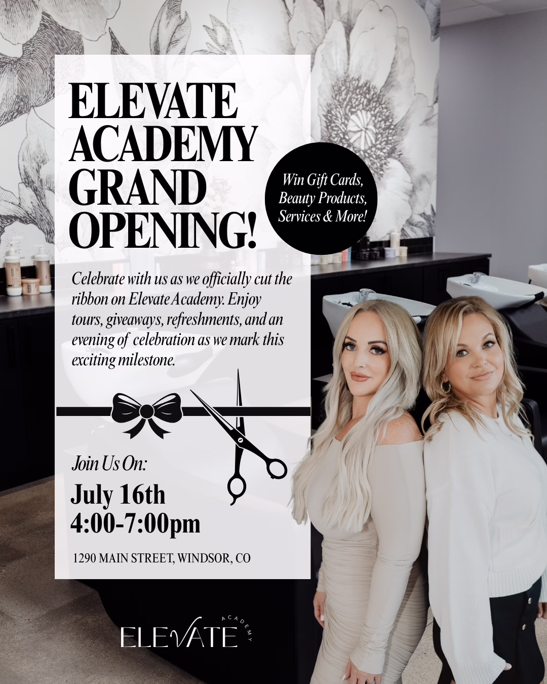Two women stand in a beauty academy with floral wall art. A sign announces Elevate Academy’s grand opening on July 16th, 4-7pm, with tours, giveaways, and refreshments at 1290 Main Street, Windsor, CO.
